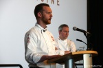 Chef Ryan Stone addresses event attendees